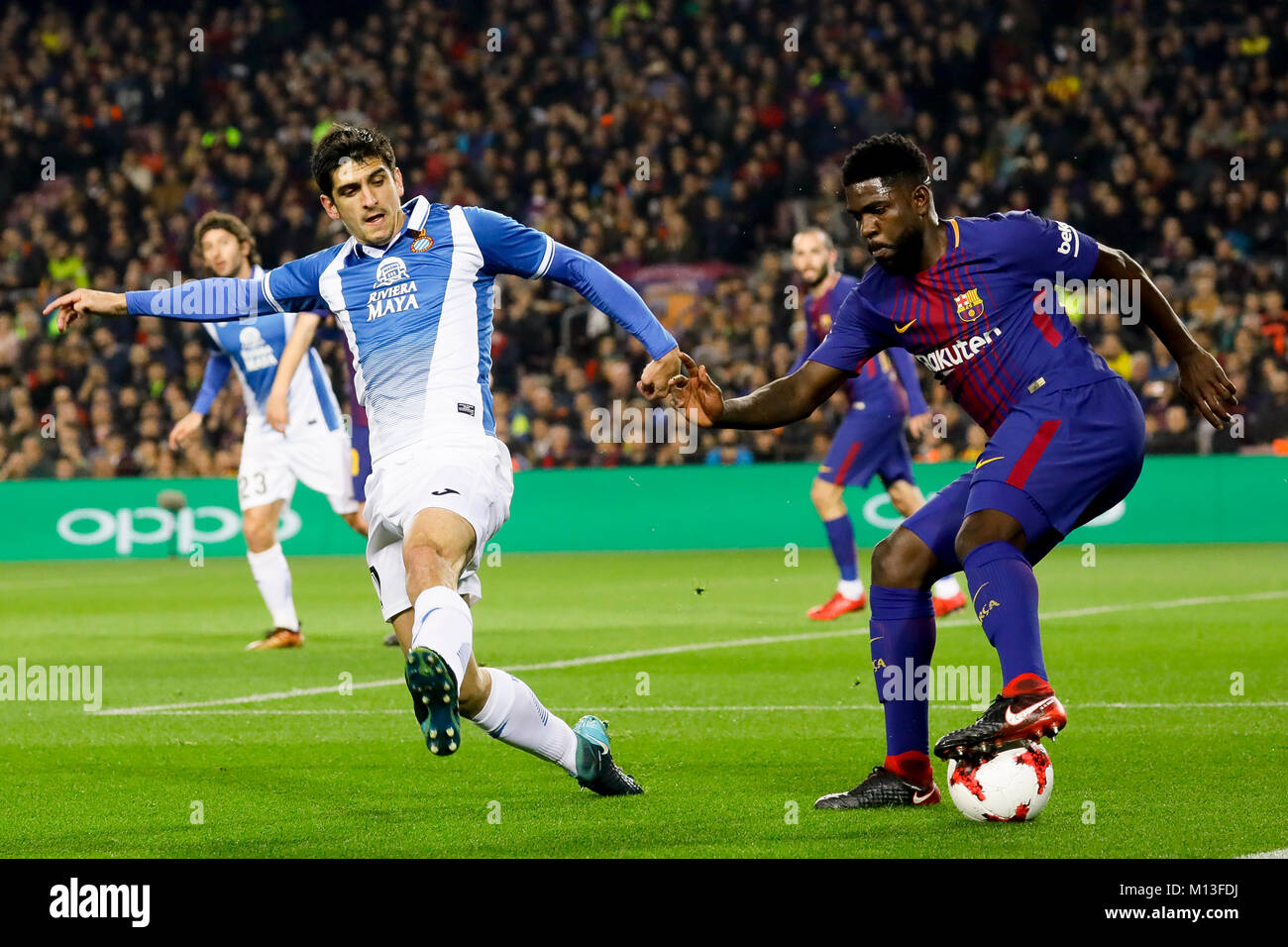 Camp Nou, Barcelona, Spain. 25th January, 2018. Samuel Umtiti dribbling to Gerard Moreno while that tries to stole it during the quarter finals of Copa de S.M. del Rey 17/18 on the match between Fc Barcelona and Rcd Espanyol at Camp Nou, Barcelona, Spain. Credit: G. Loinaz/Alamy Live News Stock Photo