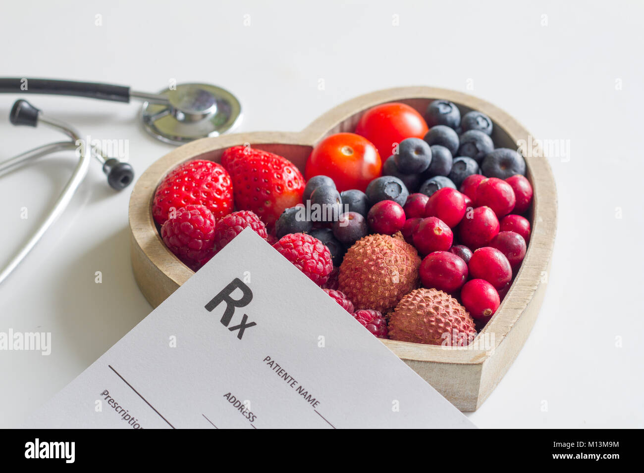 Health diet with heart stethoscope and medical prescription concept Stock Photo