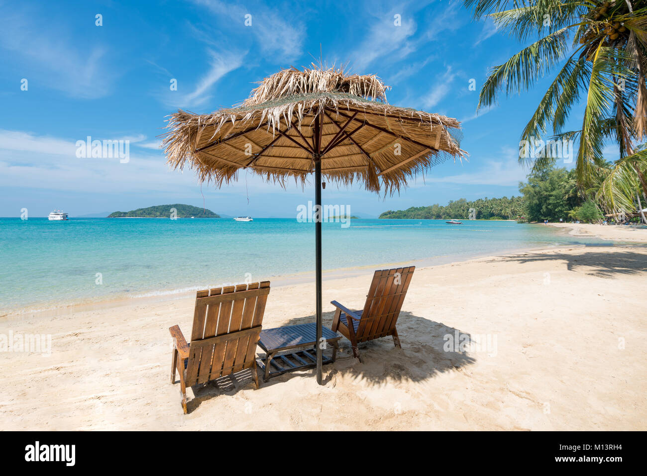 Beach Chairs and Umbrella on summer island in Phuket, Thailand. Summer, Travel, Vacation and Holiday concept. Stock Photo