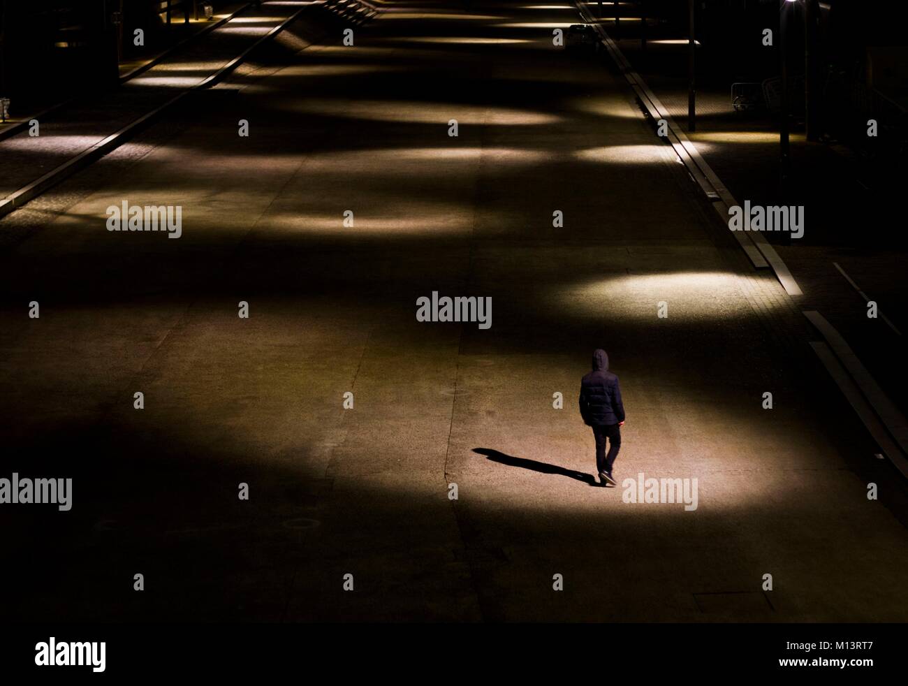 Man walking alone hi-res stock photography and images - Alamy