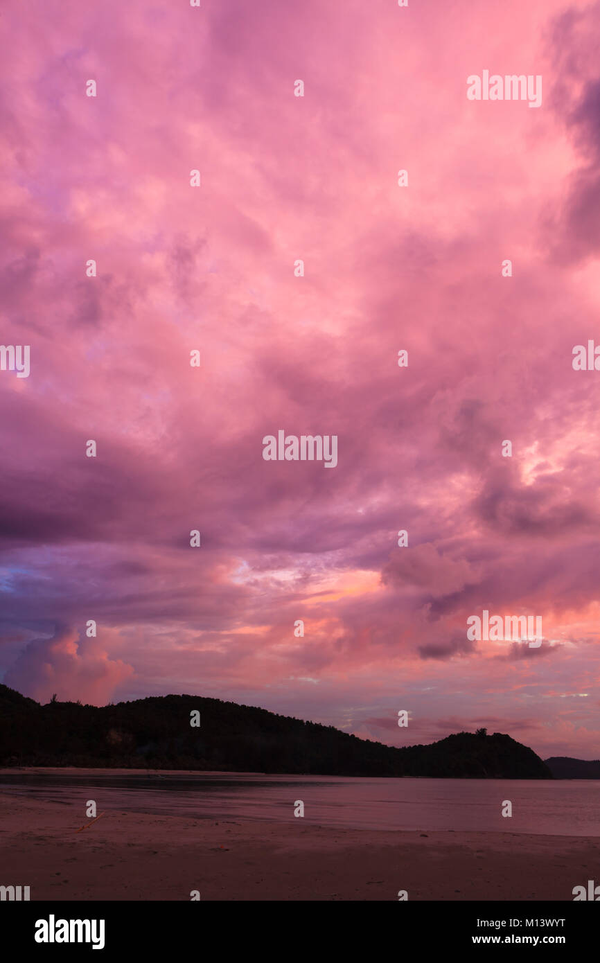 Colorful purple sunset at sand beach borneo Stock Photo