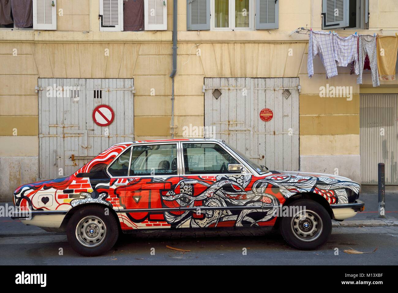 France, Bouches du Rhone, Marseille, Panier district, rue Sainte-Francoise, car BMW 520 from Undartground concept store decorated by a graffiti artist Stock Photo