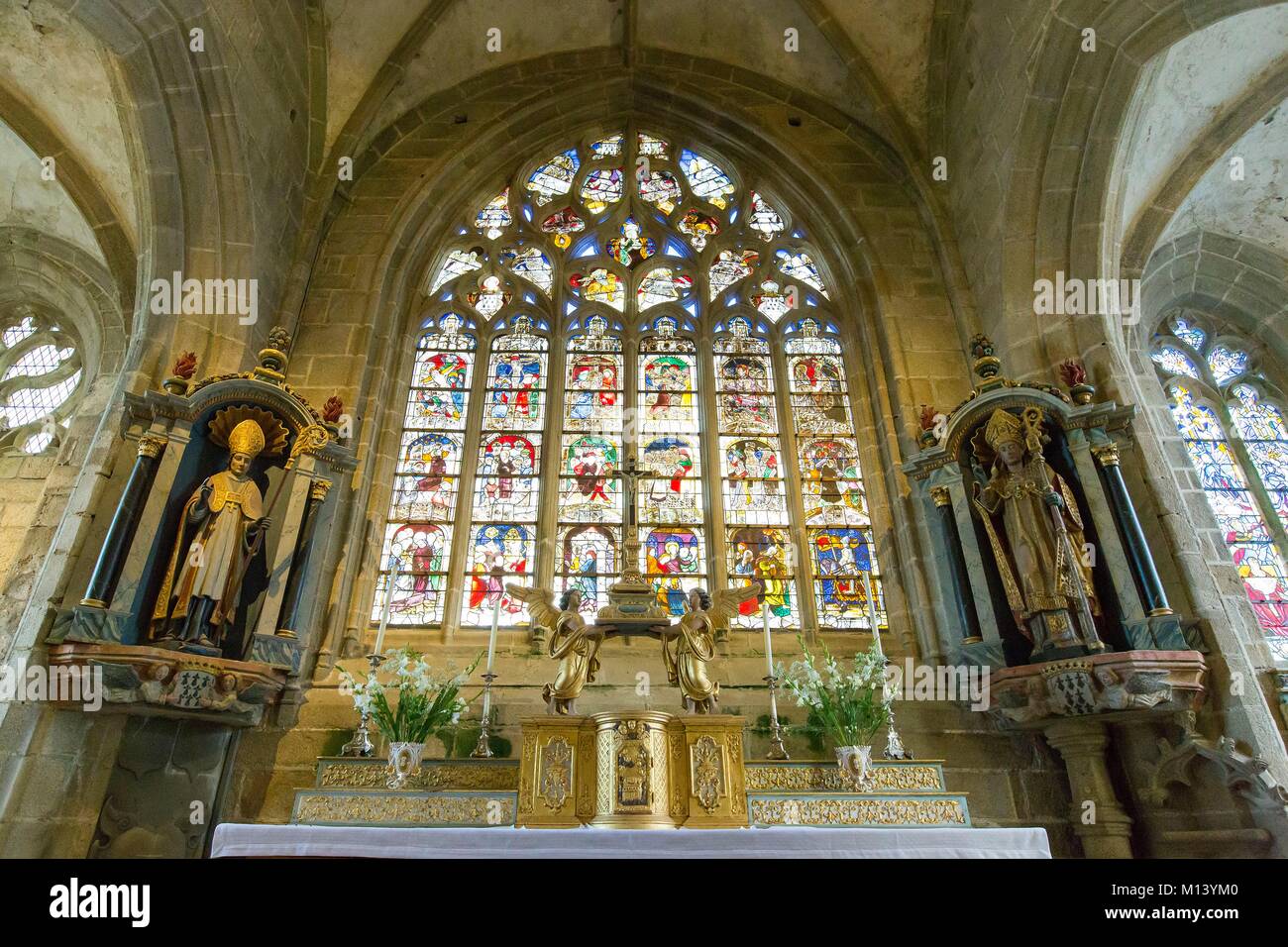 France, Finistere, Locronan labelled Les Plus Beaux Villages de France (One of the Most Beautiful Villages of France), Saint Ronan church, the 18th century main altar and the great glass stained window Stock Photo