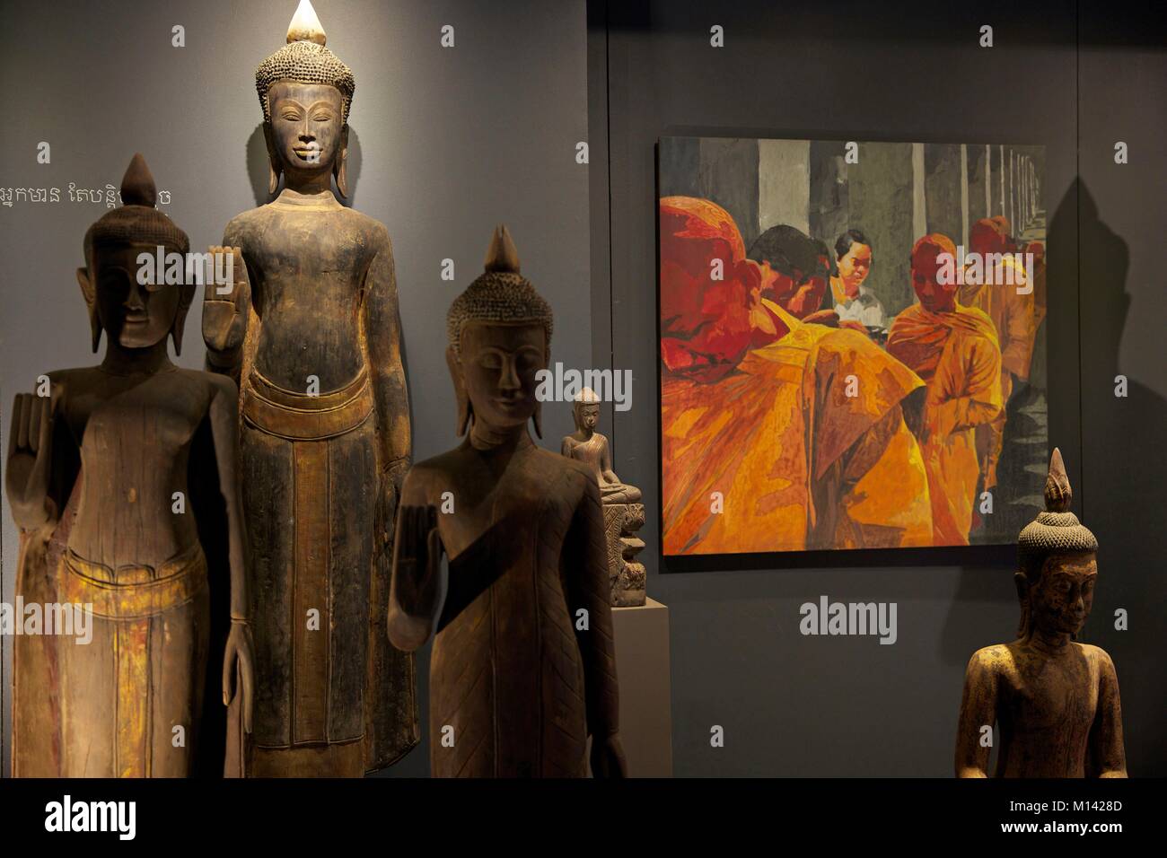 Cambodia, Siem Reap, collection of old statues of buddha and laquered painting in the art gallery of the Theam's house shop Stock Photo