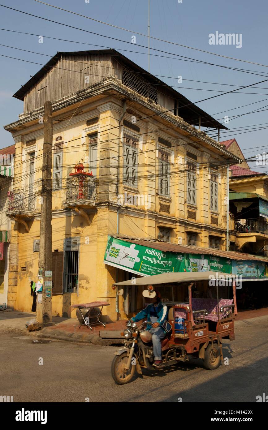 Cambodia, Battambang, rickshaw passing in front of french colonial ...