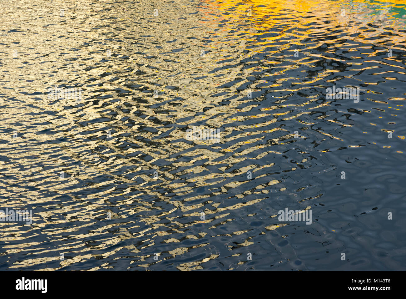 reflection Harstad harbour in Lofoten islans in Norway Stock Photo