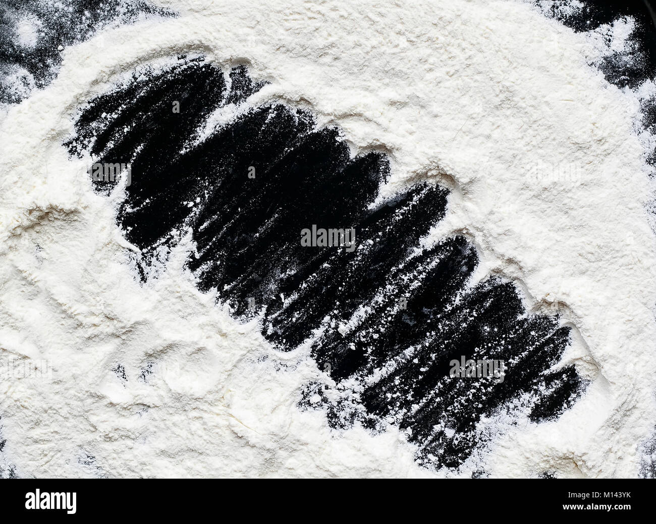 background for recording of crumbly white wheat flour on the black ...