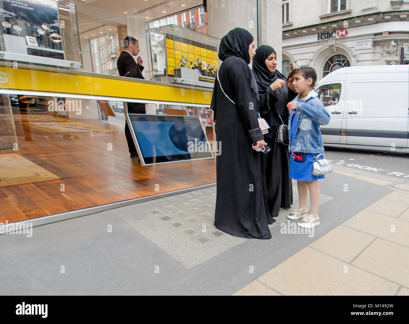 London, England, UK. Muslim family - women and young girl Stock Photo