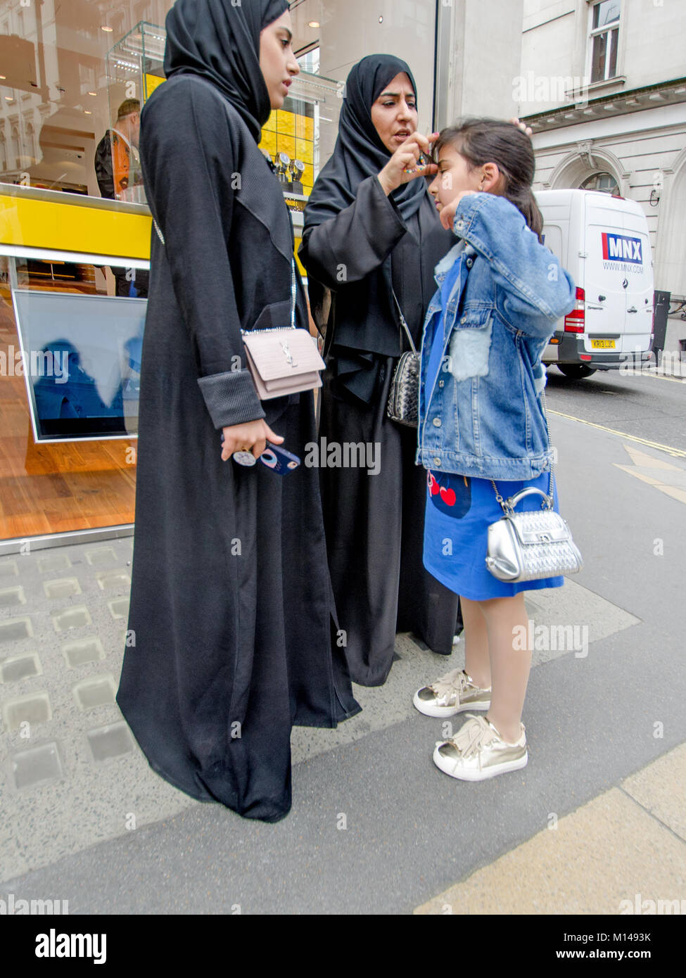London, England, UK. Muslim family - women and young girl Stock Photo