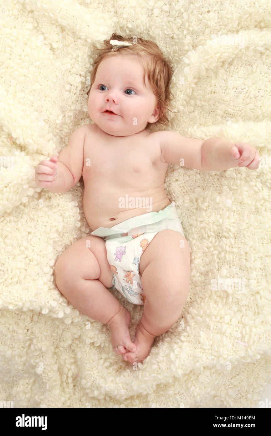 3 month old baby girl on blanket in nappy Stock Photo Alamy