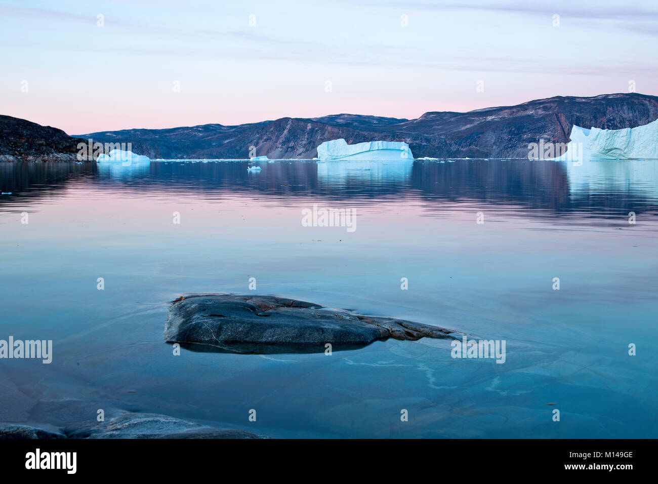 Iceberg in midnight sun, Ilulissat, Jakobshavn glacier, Disko Bay. Greenland Stock Photo
