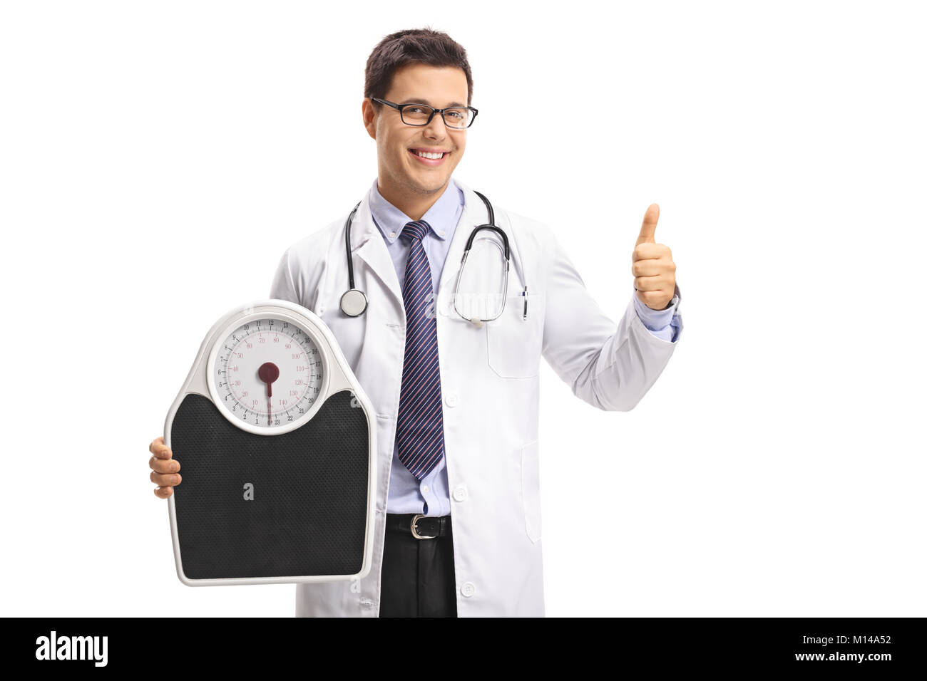 Doctor holding a weight scale and making a thumb up gesture isolated on white background Stock Photo