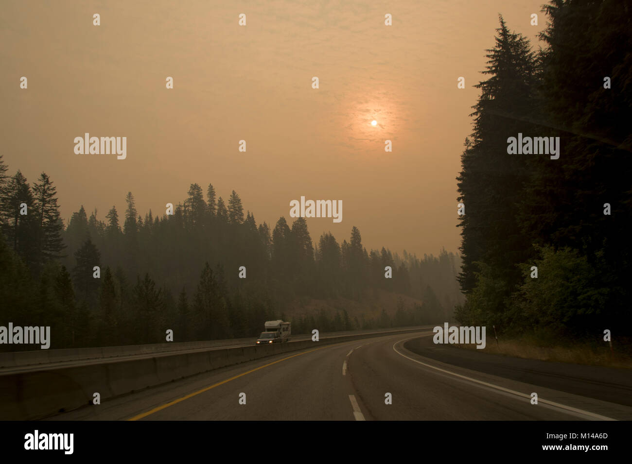 Driving on I-90 in smole from the Jolly Mountain fire, outside Cle Elum, Washington, USA. Stock Photo
