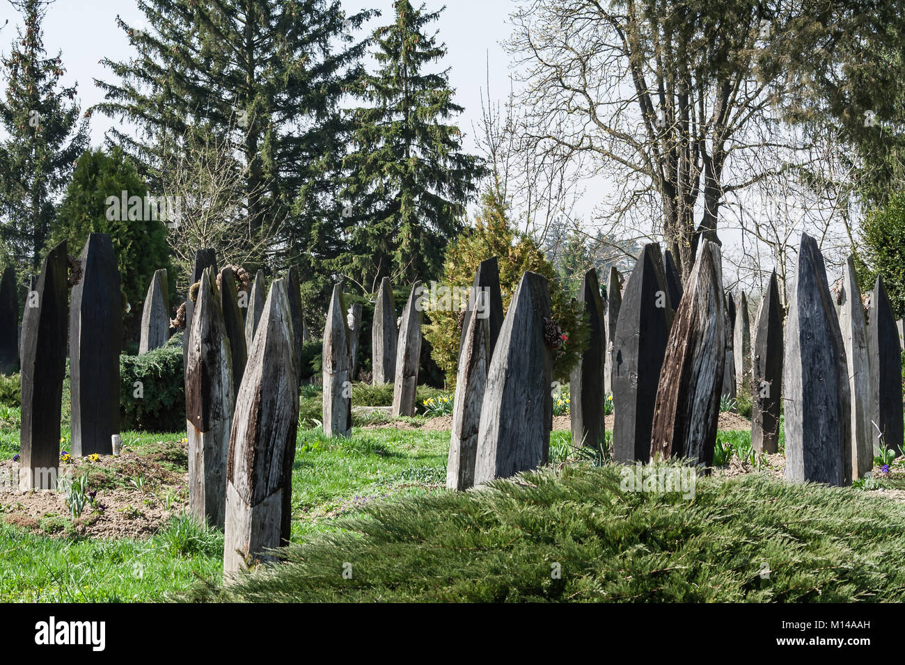 Historical cemetry in Hungary with special grave-markers, made of wood, looks like a boat. Stock Photo