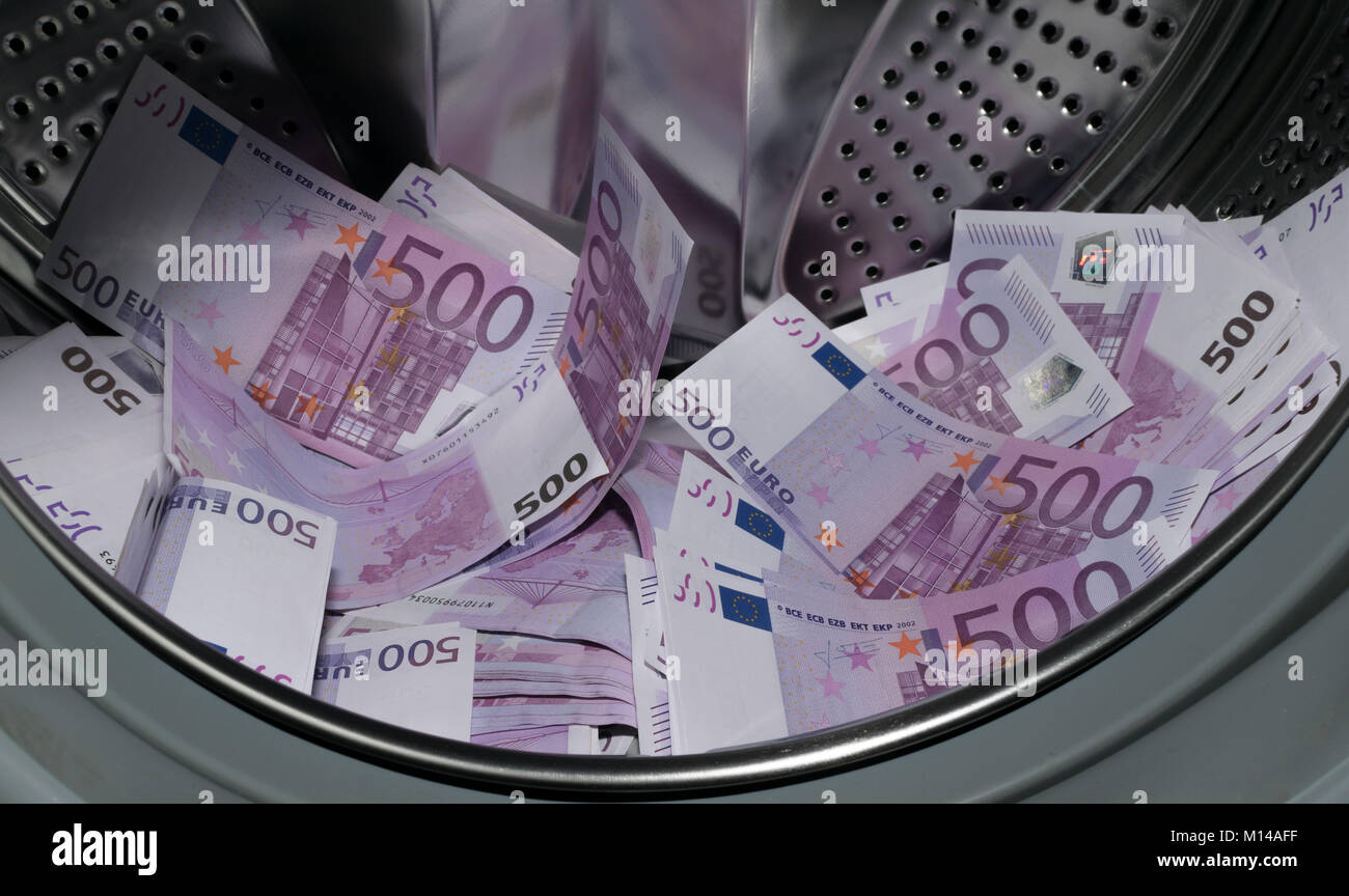Financial crisis. Money laundering money in the washing machine Stock