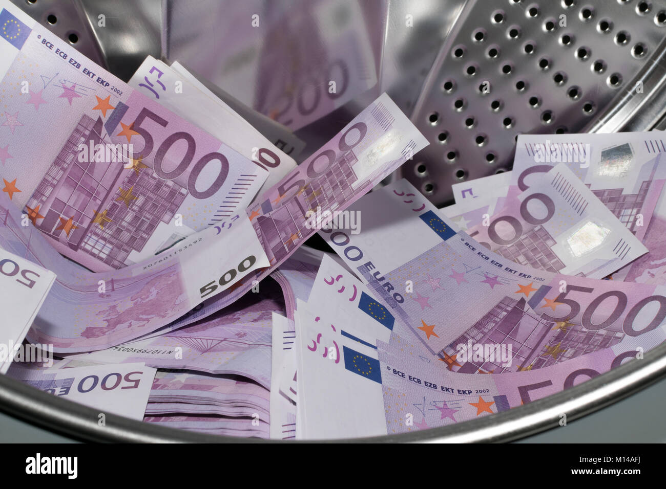 Financial crisis. Money laundering money in the washing machine Stock