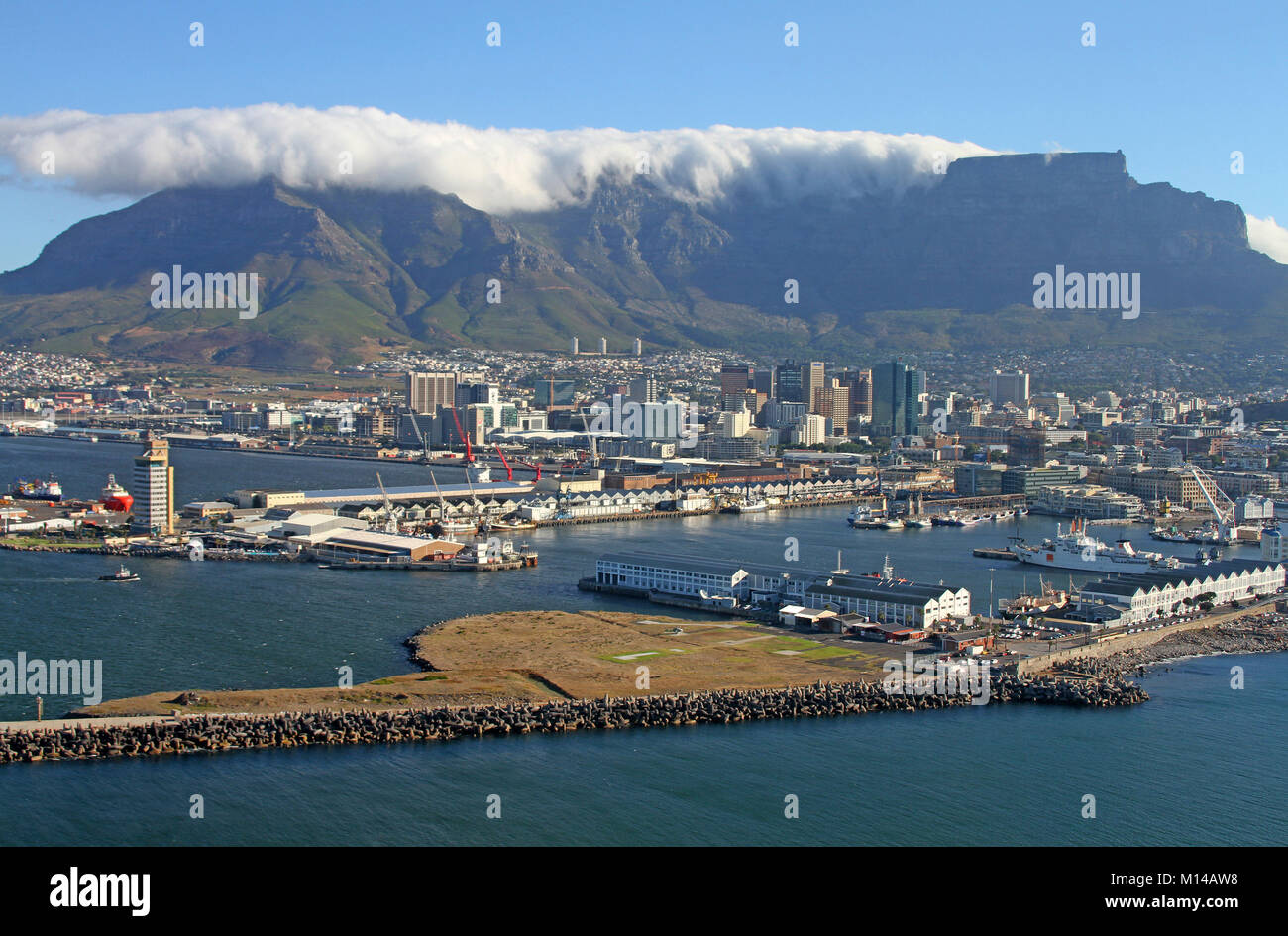 Table Mountain and Devil's Peak with cloud tablecloth seen from the harbour in a helicopter, Cape Town, Western Cape, South Africa. Stock Photo