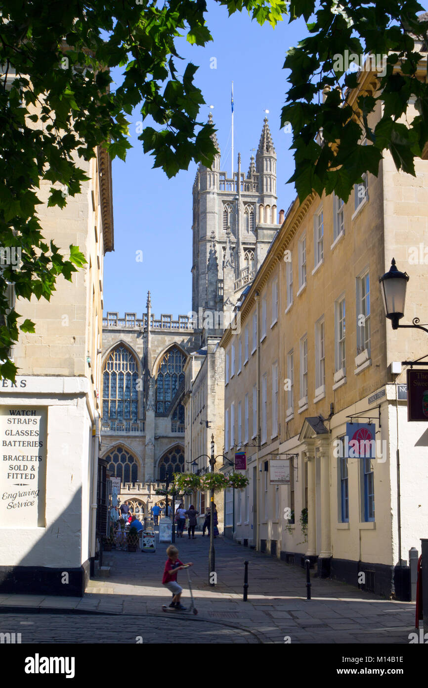 Bath, UK - 3rd July 2011: Sightseers in a shady street near Bath Abbey, City of Bath, Somerset, UK. Bath is a UNESCO World Heritage Site famous for it's architecture. Stock Photo
