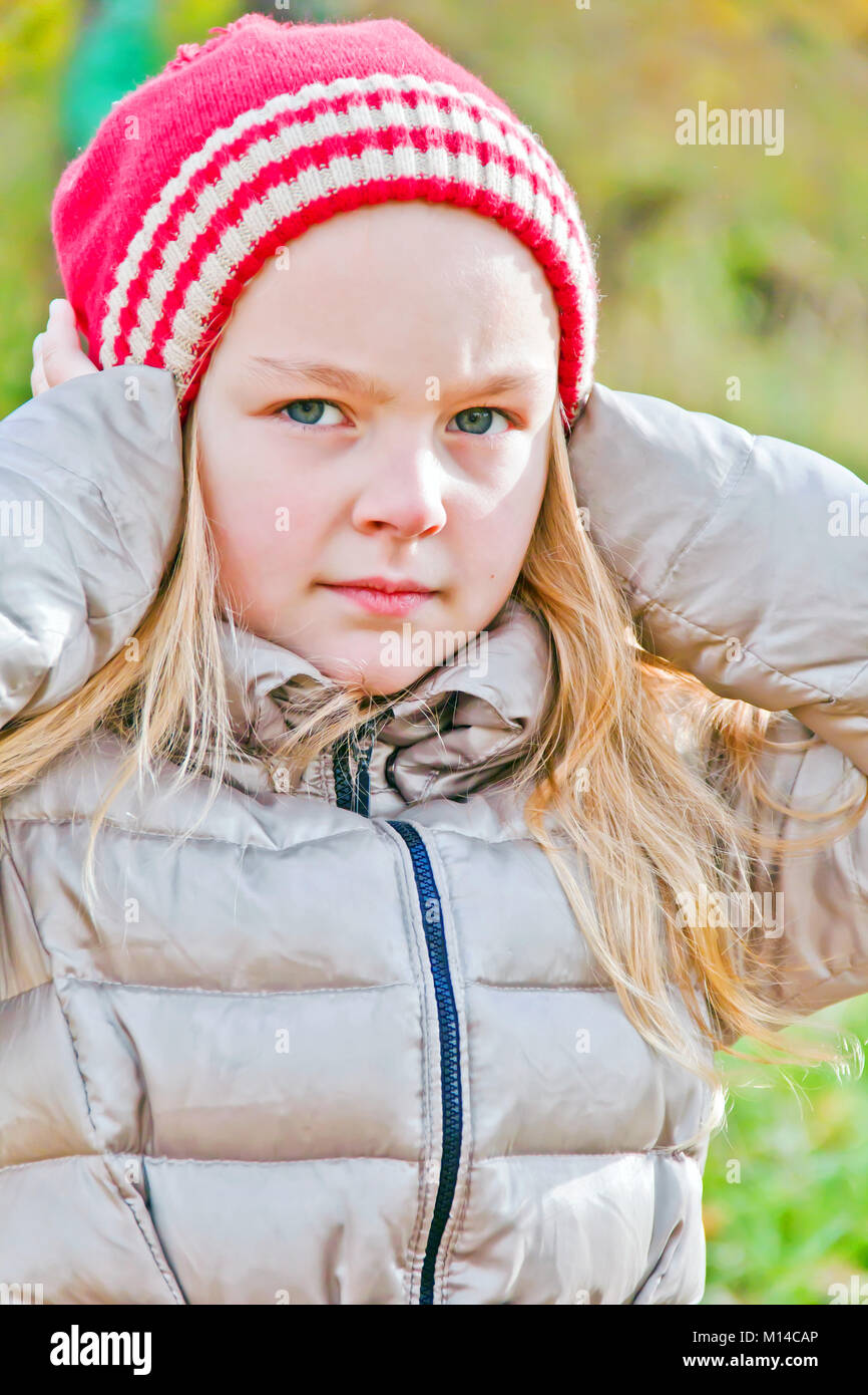 Photo of cute smiling girl in autumn Stock Photo - Alamy