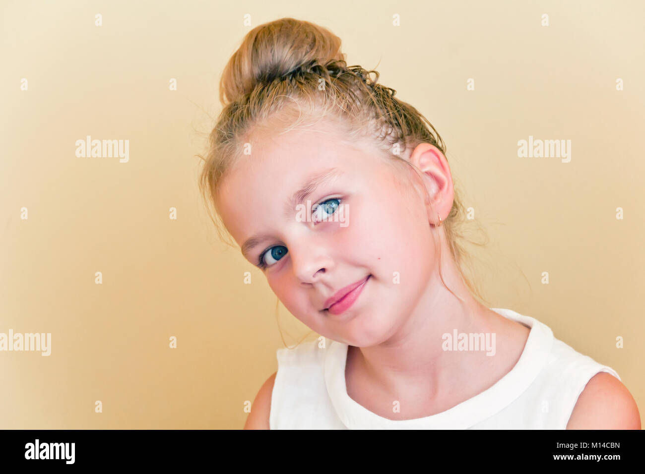 Cute girl with blond long hair and blue eyes Stock Photo - Alamy