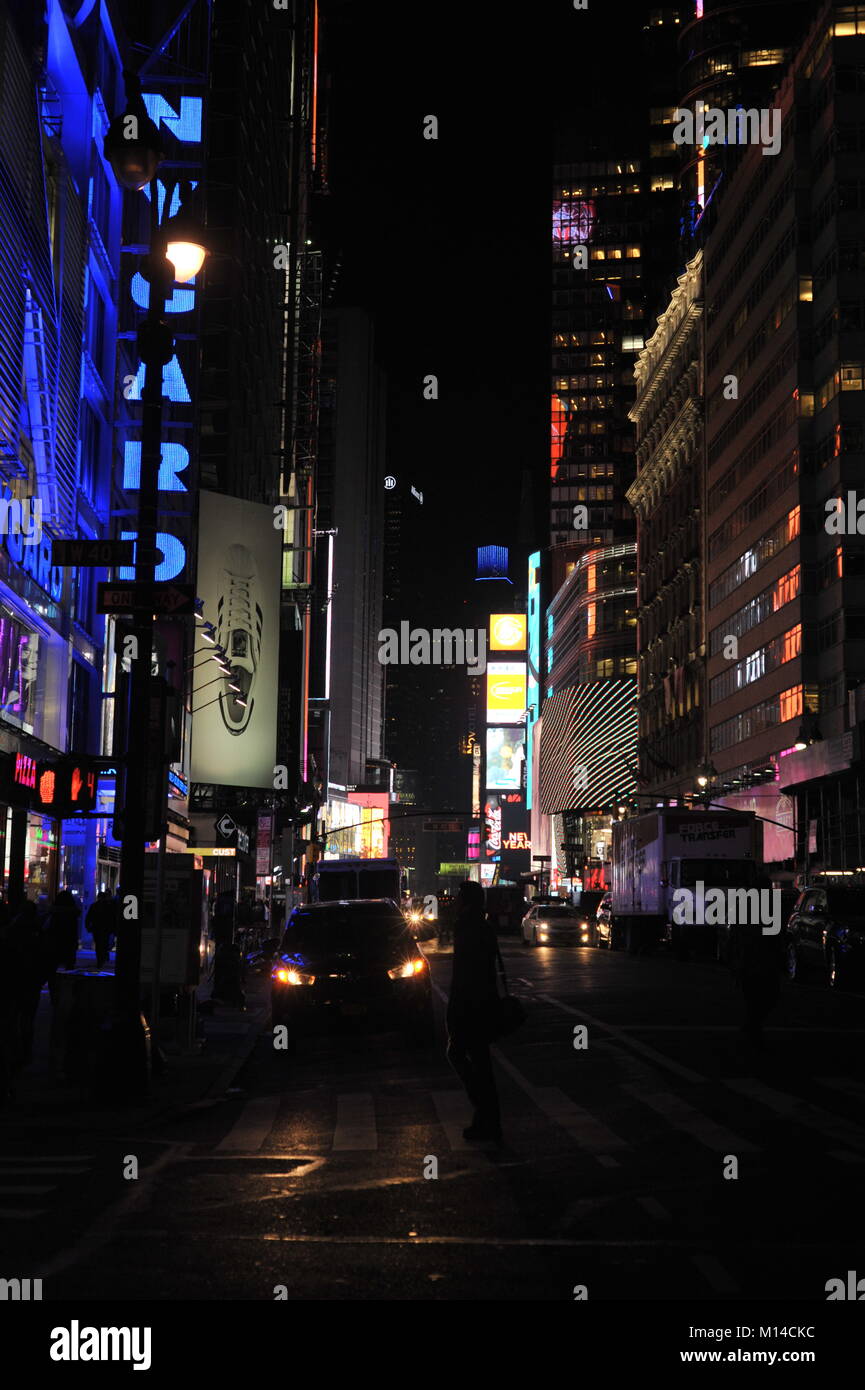 Gloomy looking street szene in downtown manhattan with tired people heading home Stock Photo