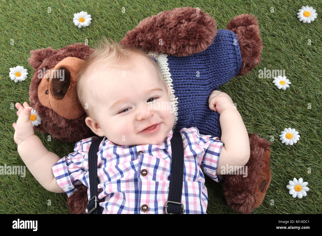 6 months old child, playing in the garden, cognitive development, stimulation,Multi Sensory Environment Stock Photo