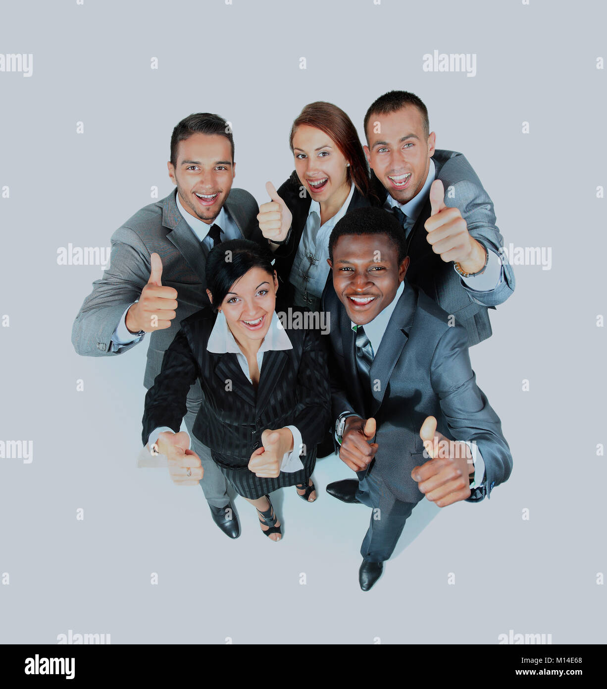 Young group of business people showing thumbs up signs in joy Stock ...