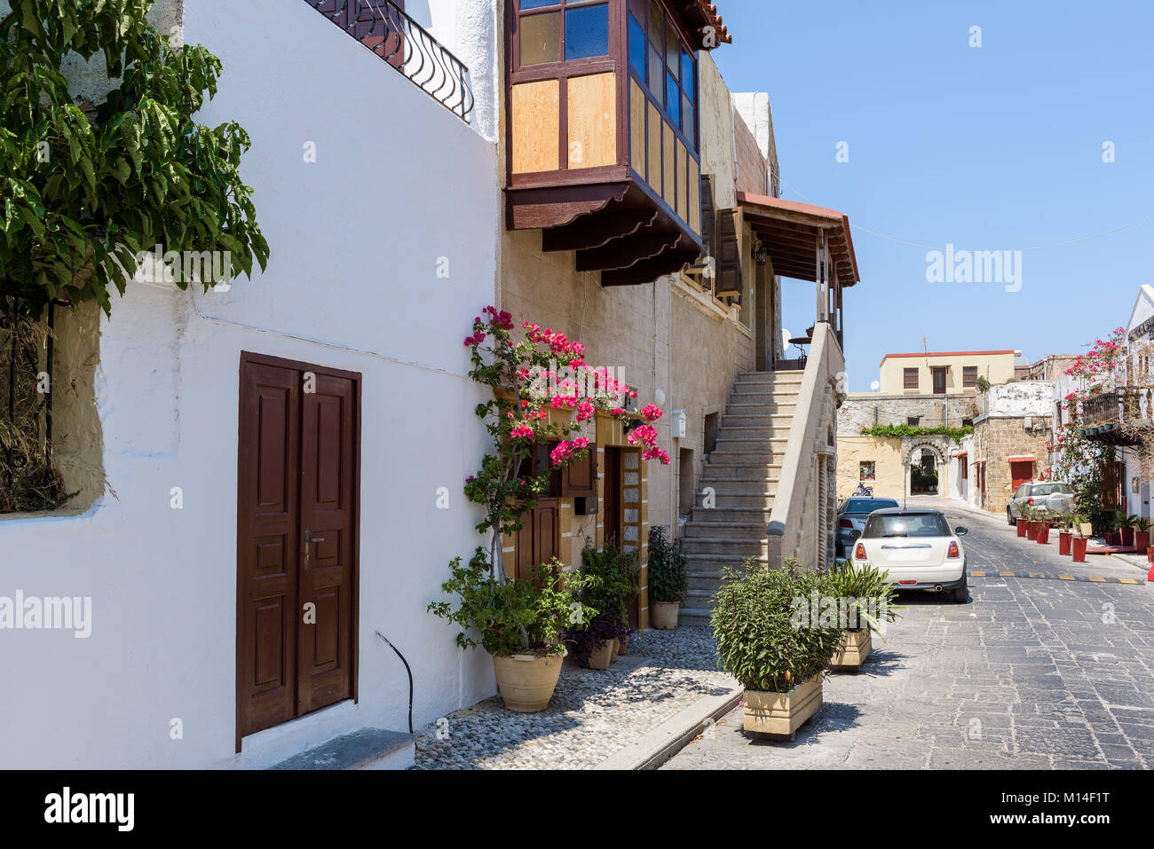 Street of Rhodes town with old houses and narrow streets Stock Photo