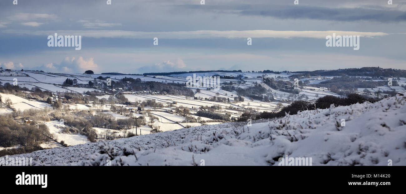 Looking east over a snow covered Nidderdale towards Glasshouses, Blazefield and Knott Side. Stock Photo