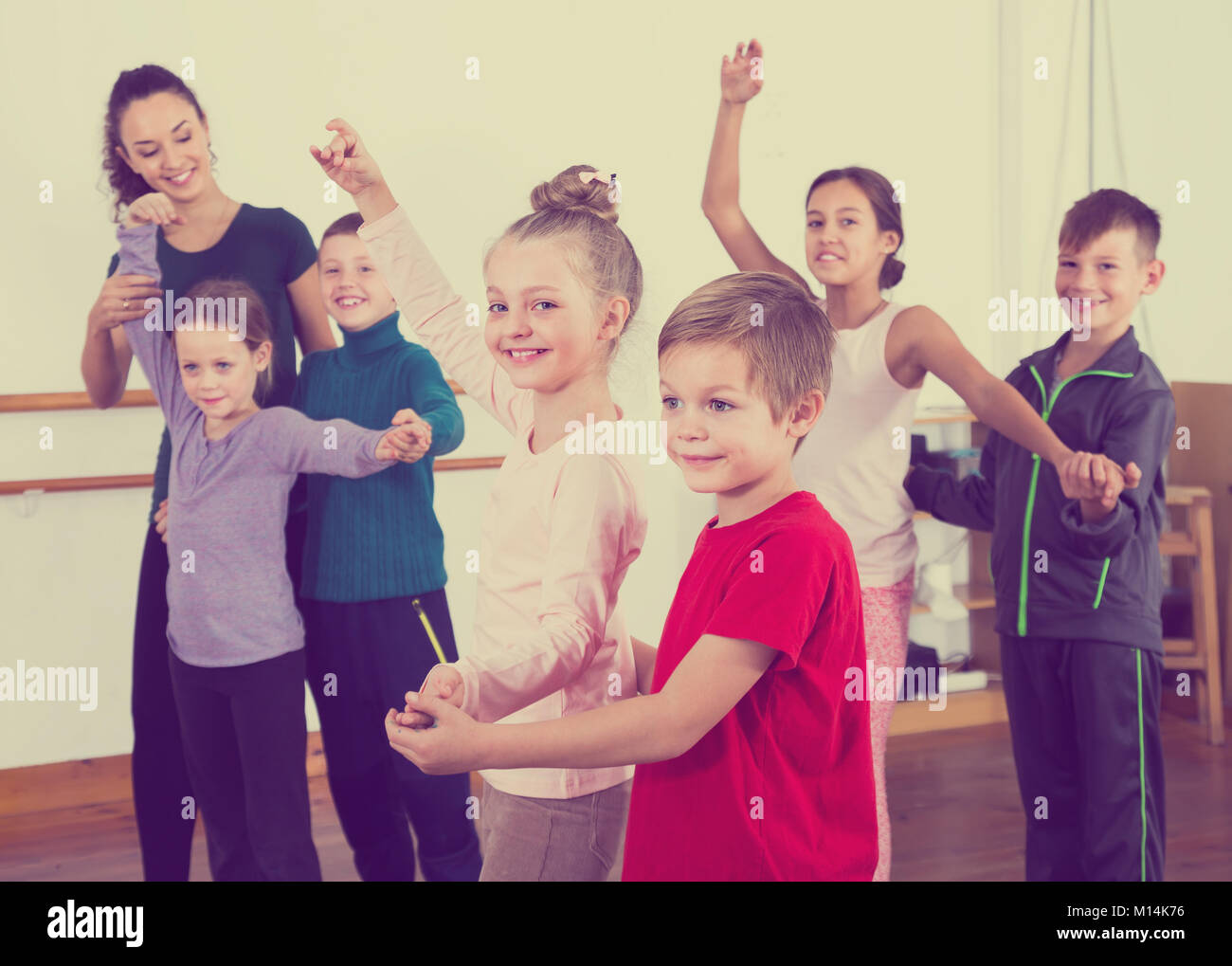 vigorous little boys and girls dancing pair dance in the ballet Stock