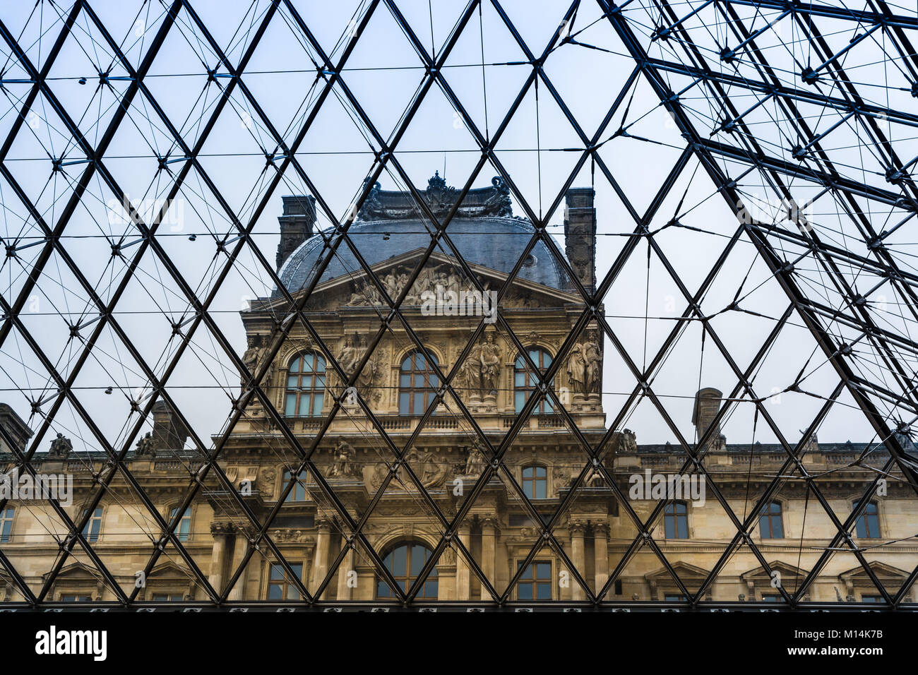 Paris, France - December 11, 2017: One of the Louvre museum's pavilions viewed from within the glas and metal pyramid. Stock Photo
