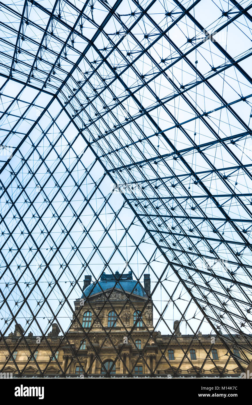Paris, France - December 11, 2017: One of the Louvre museum's pavilions viewed from within the glas and metal pyramid. Stock Photo