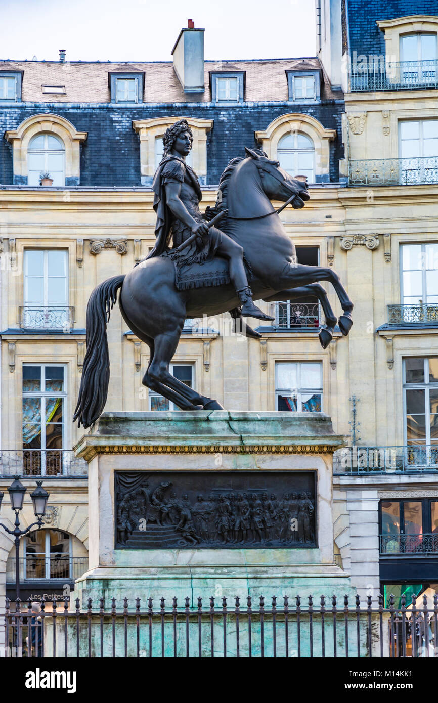 Paris, France - December 10, 2017: Statue of King Louis XIV in Victory Square (Place de Victoires) comissioned by King Louis XVIII to Francois Joseph  Stock Photo