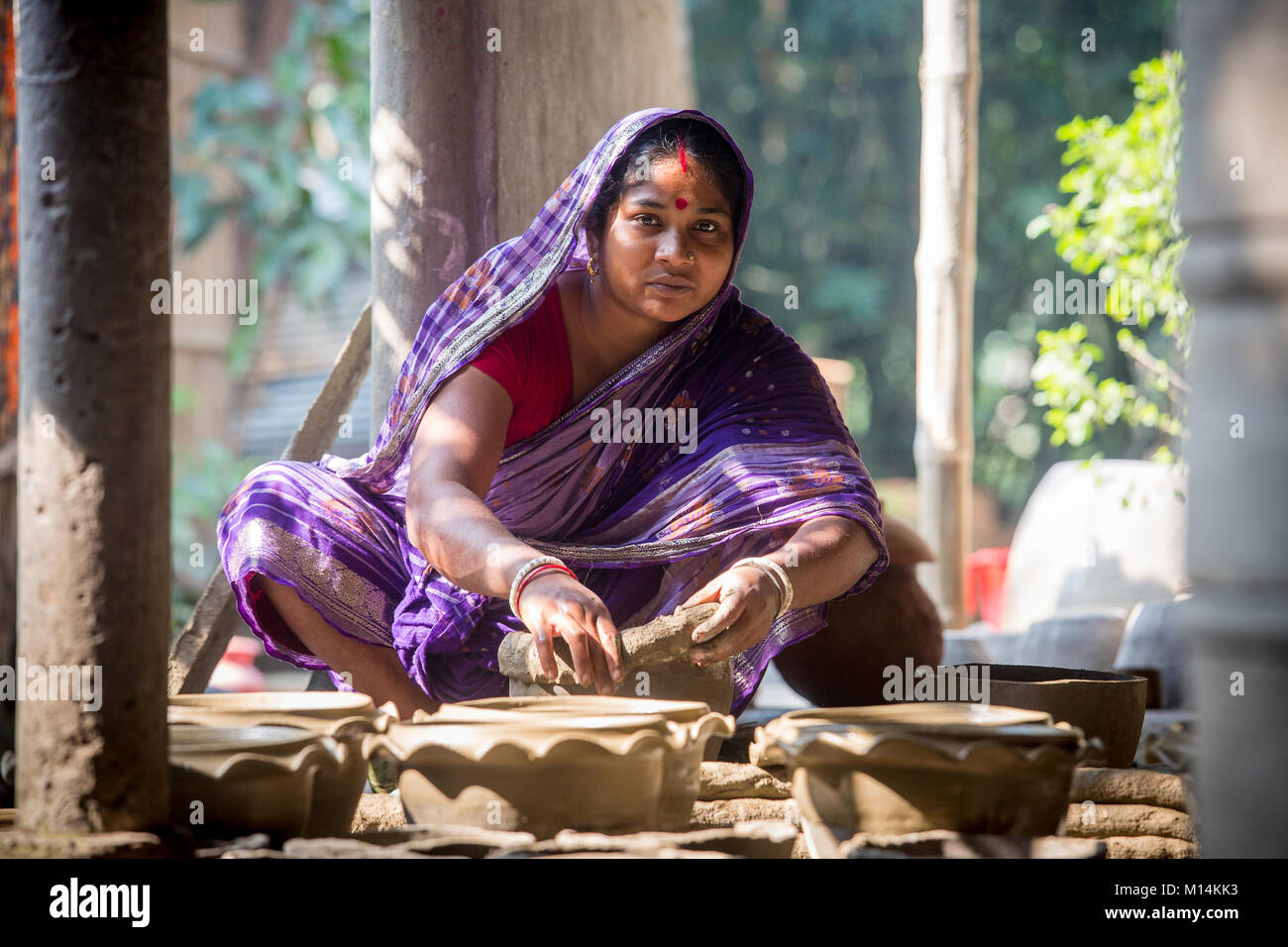 Kobita Rani Pal shapes a pottery at Iswardi, Bangladesh. Stock Photo