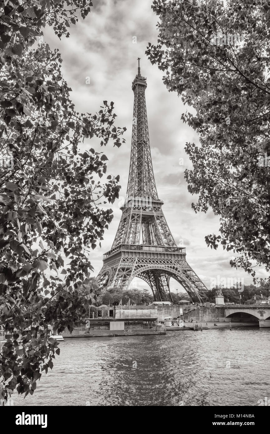 View from the Seine shore to the eiffel tower in paris in black and white colors. Stock Photo