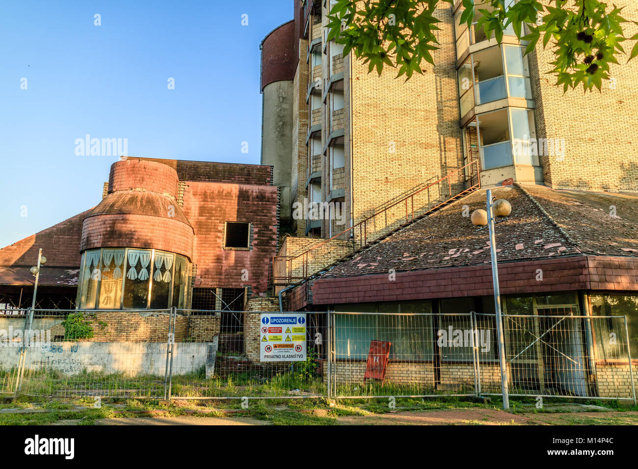 Hotel Dunav fenced off from the public with battle scars from the Croatian War of Independence. Vukovar, Croatia Stock Photo