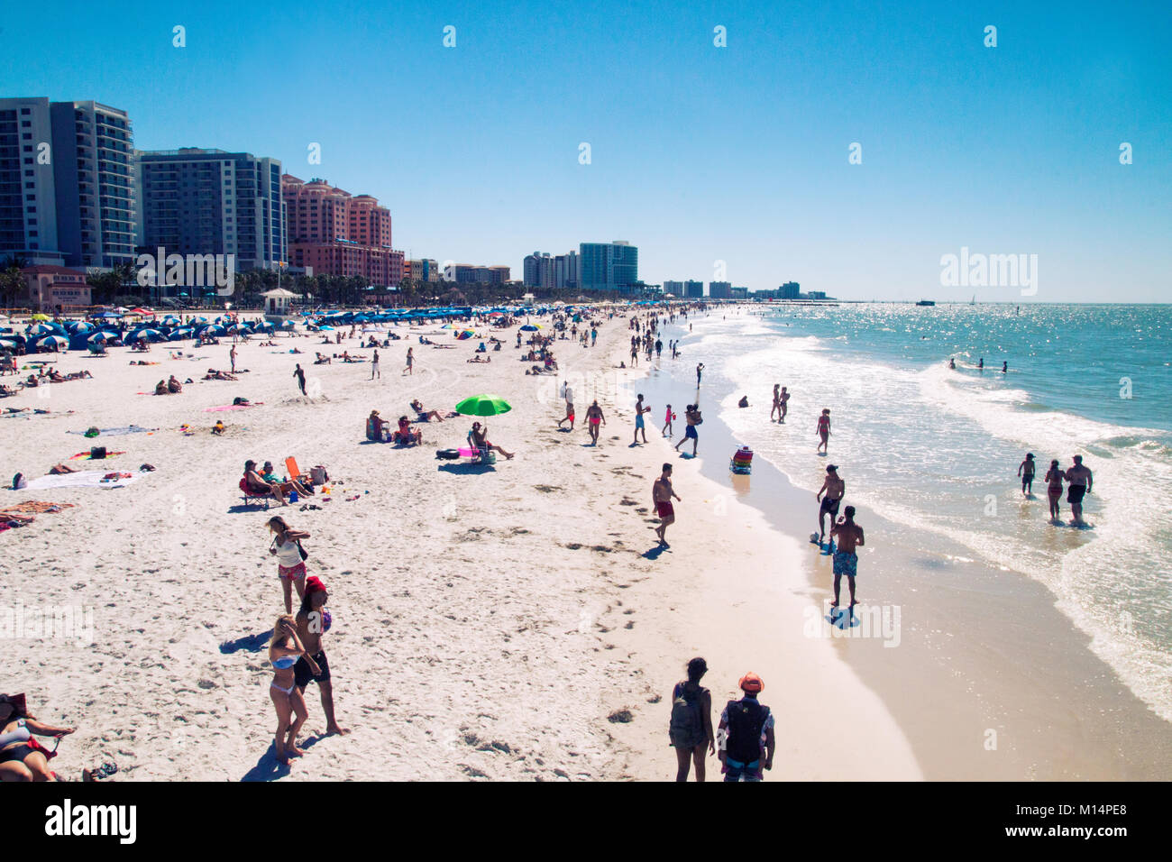 Crowded beach, exotic sandy beach, people enjoying the sun, Florida beach view, Clearwater beach Stock Photo