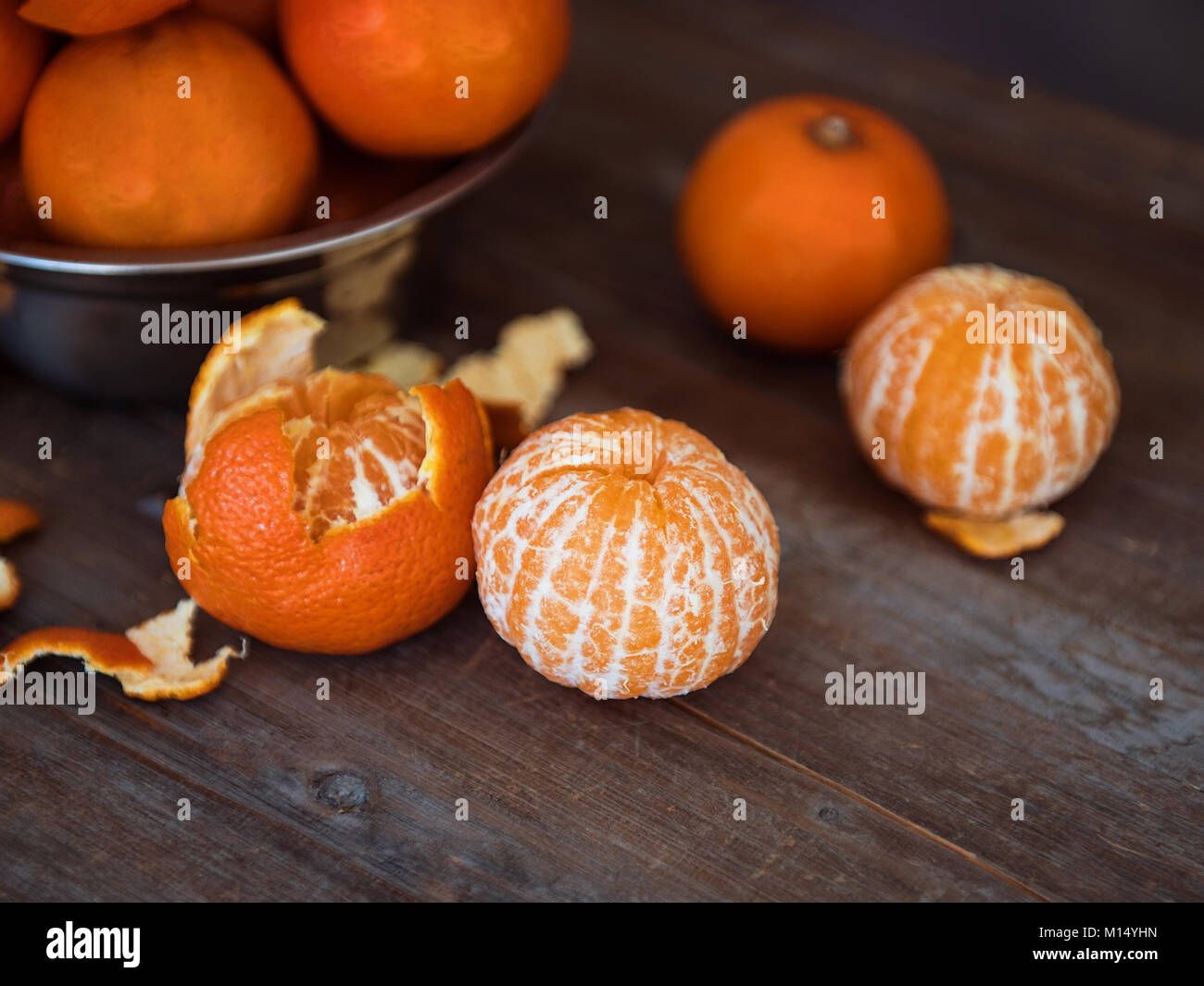 Fresh mandarins and peeled mandarins Stock Photo Alamy