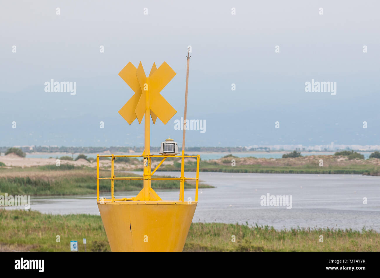 automatic yellow lighthouse, Ebro Delta, Tarragona, Catalonia, Spain Stock Photo