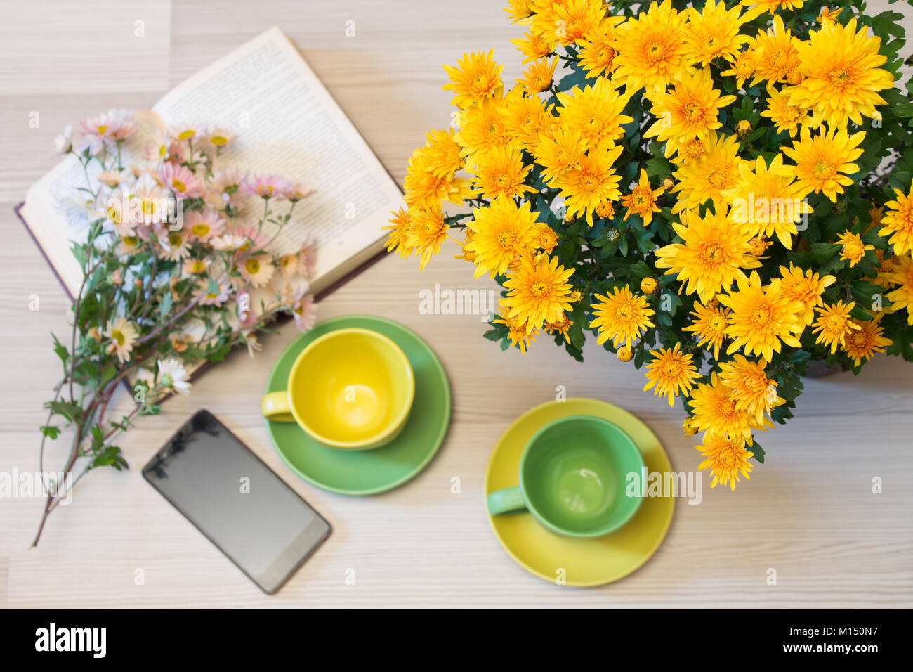 bouquet of yellow chrysanthemums on a table on a blurred background