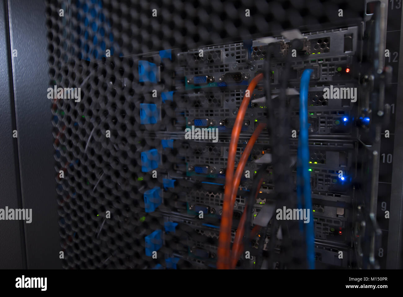 closeup of a modern data center hardware rear side of storage server ...