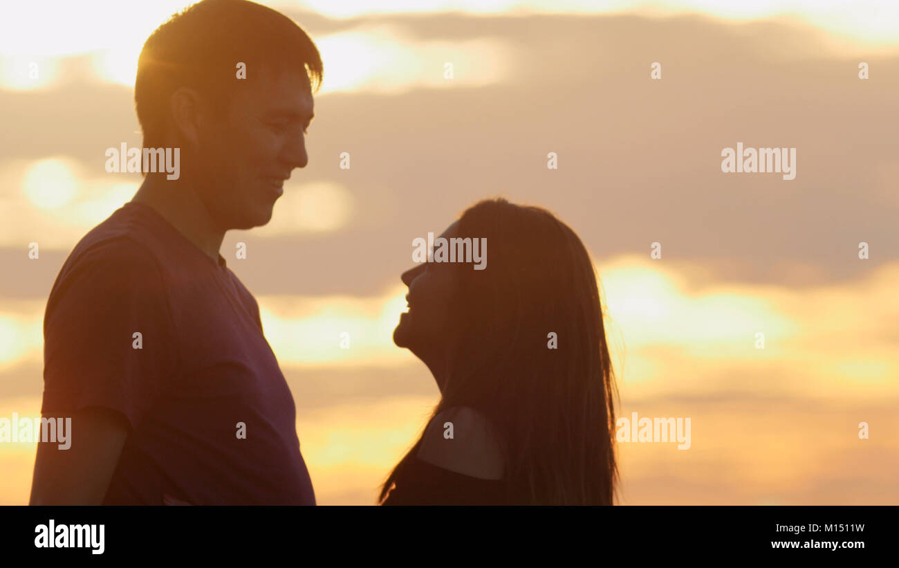 Portrait of loving couple - man and woman at sunset Stock Photo - Alamy