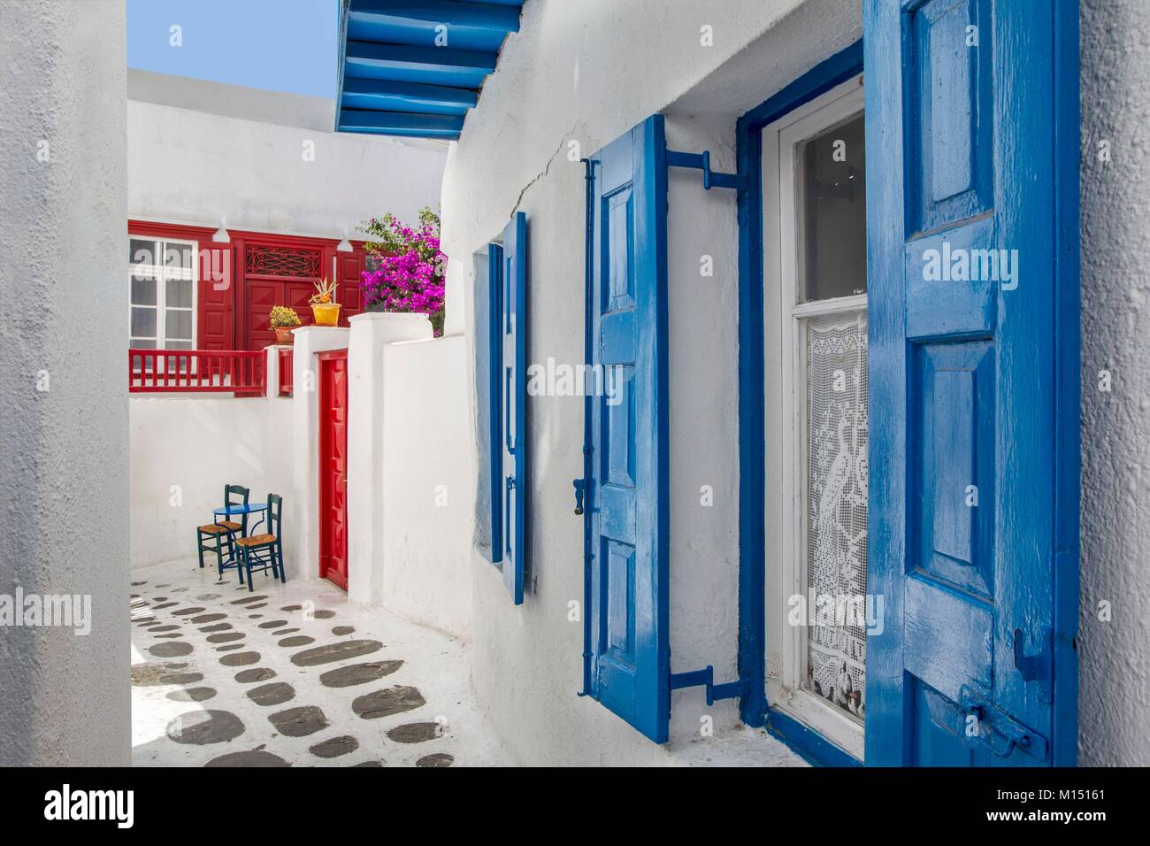 Greece, Cyclades islands, Mykonos island, narrow street with painted floor and colored staircases Stock Photo