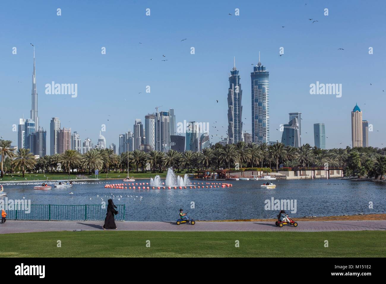 United Arab Emirates, Dubai, Business Bay area with Burj Khalifa on left side, with Safa park at the foreground Stock Photo