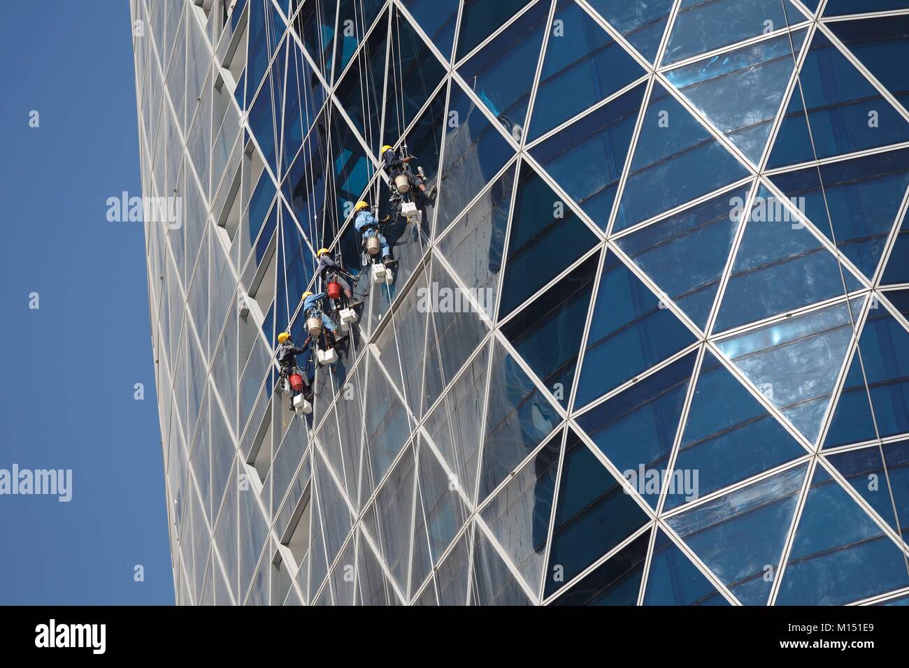 United Arab Emirates, Dubai, DIFC, cleaners on Park Towers by Damac after desert storm Stock Photo