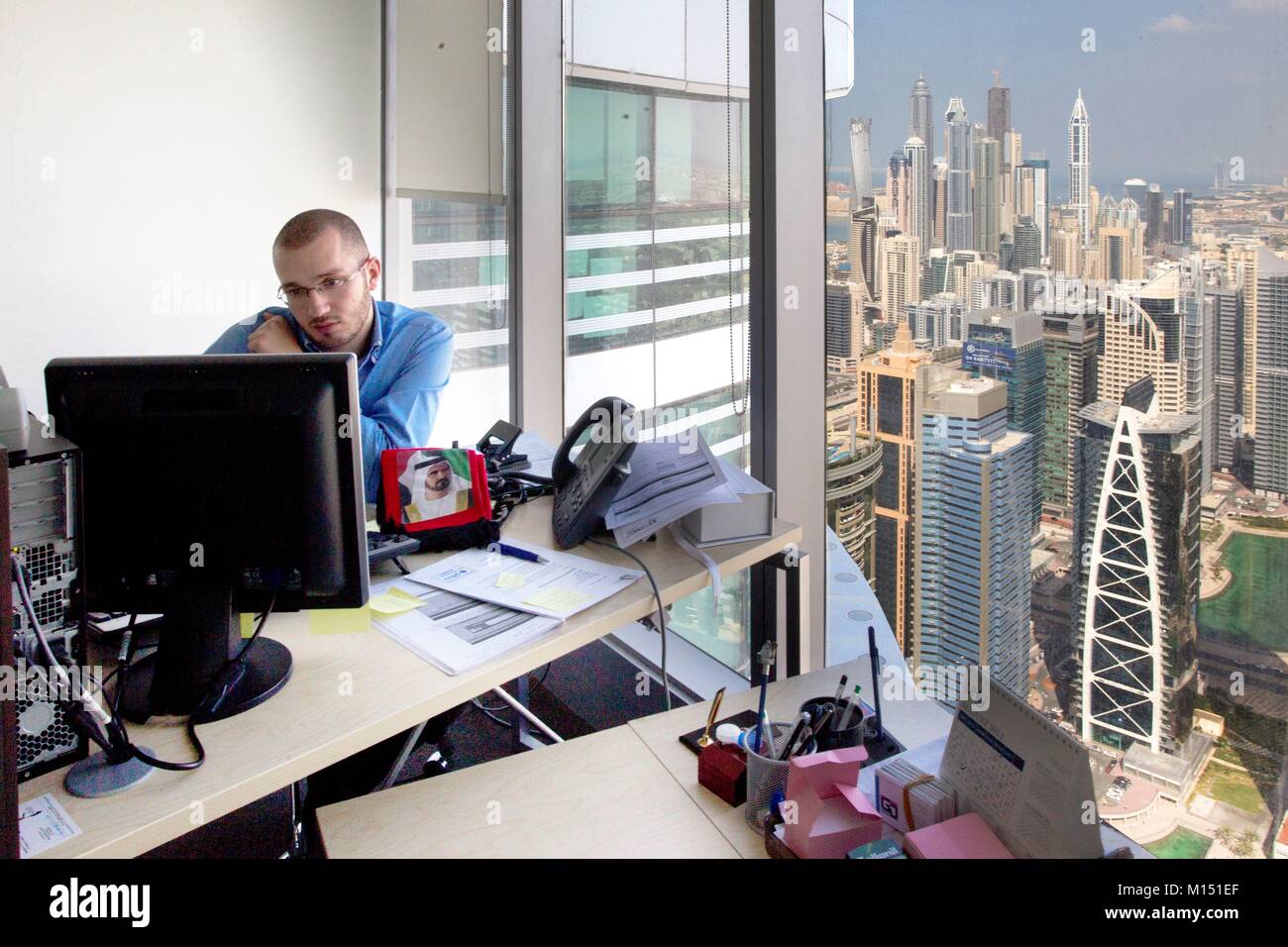 United Arab Emirates, Dubai, office with view on JLT, Jumeirah Lake Towers and Al Sufouh towers Stock Photo
