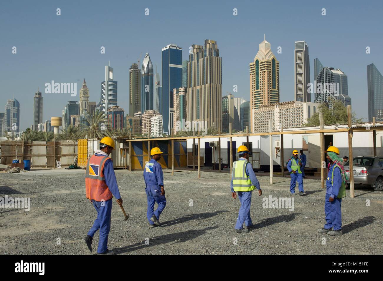 United Arab Emirates, Dubai, Sheikh Zayed skyline with construction site and workers Stock Photo