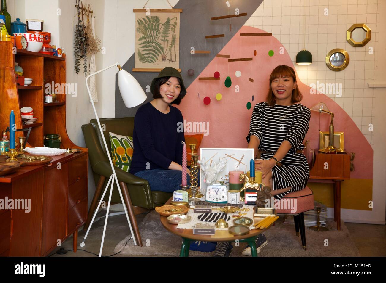 South Korea, Seoul, Gyedong, two women sitting in a docration vintage shop Stock Photo