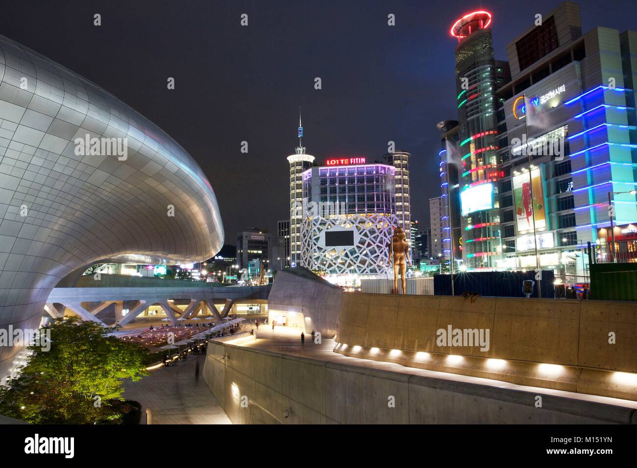 South Korea, Seoul, Dongdaemun Design Plaza, futuristic building of the architect Zaha Hadid, in the middle of the building of Dongdaemun, lit at night Stock Photo