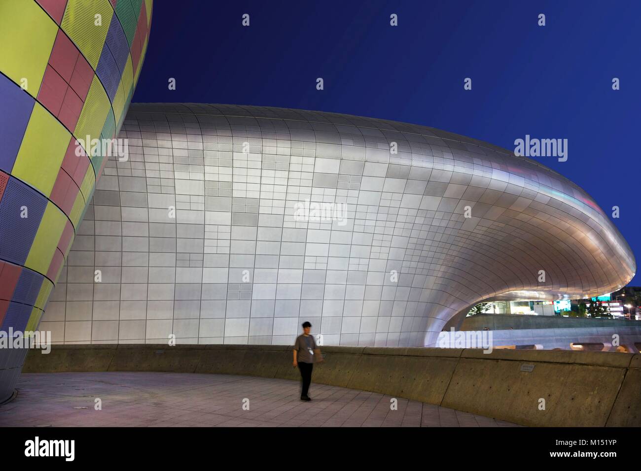 South Korea, Seoul, Fabien Yoon, man in front of the Dongdaemun Design Plaza, futuristic building of the architect Zaha Hadid Stock Photo